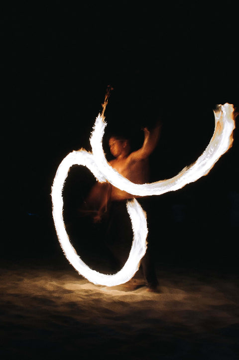 Fire dancer at night hot fire